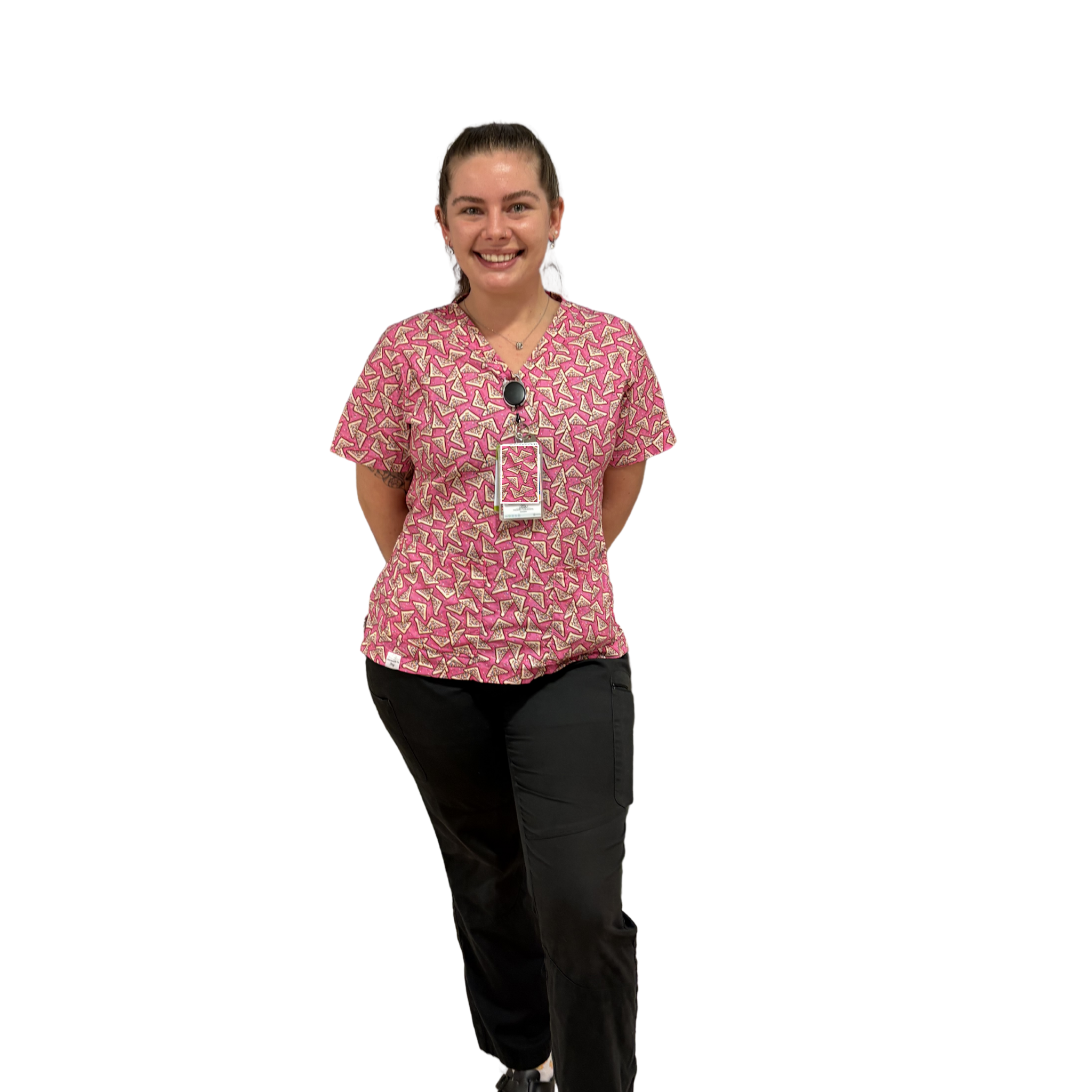 Person wearing the fairy bread patterned scrub top that is 100% cotton on a white background 